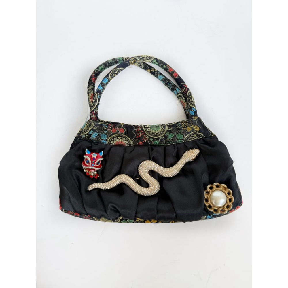 Black multi color print dragon, snake and pearl handbag